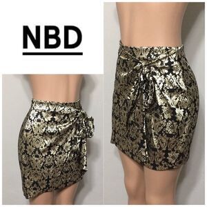 NBD gold and black high waisted faux wrap shirt.